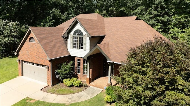 540 Branch Dr, Pendergrass, GA 30567 - view of front of property with a front lawn, concrete driveway, an attached garage, and brick siding