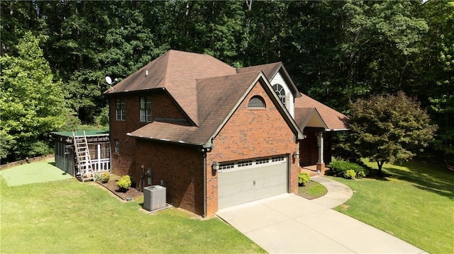540 Branch Dr, Pendergrass, GA 30567 - view of front of home with brick siding, concrete driveway, a front lawn, and a shingled roof