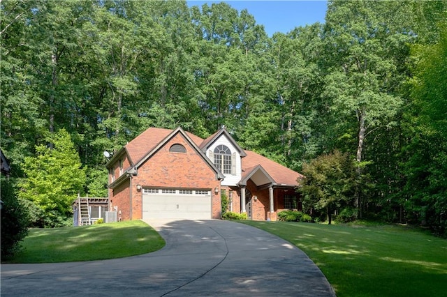 540 Branch Dr, Pendergrass, GA 30567 - view of front of home featuring driveway, brick siding, a front lawn, and an attached garage