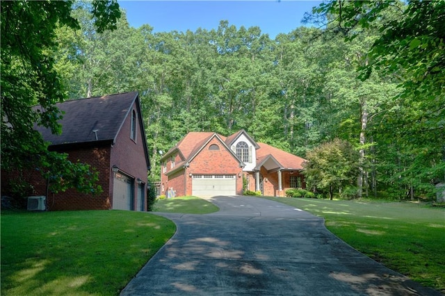 540 Branch Dr, Pendergrass, GA 30567 - view of front of house with brick siding, a front lawn, driveway, and a garage