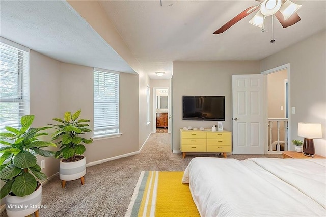carpeted bedroom with baseboards and a ceiling fan