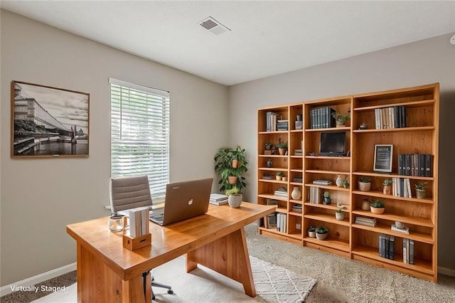 office featuring carpet floors and baseboards