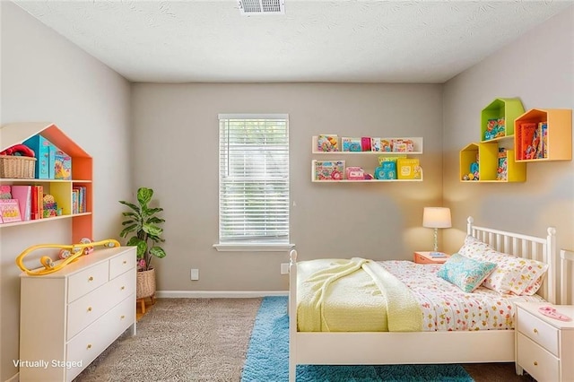 carpeted bedroom with baseboards