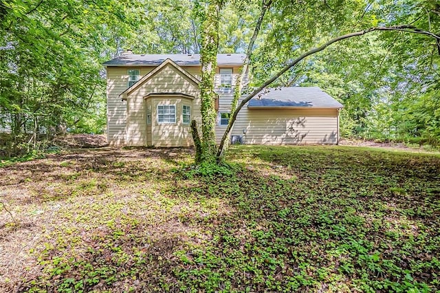 view of front of house featuring a chimney