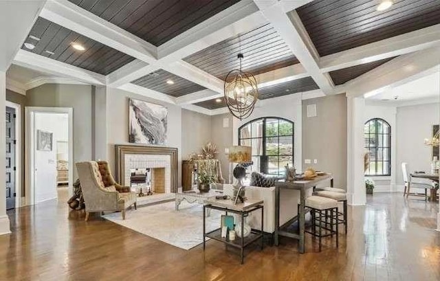 lobby featuring coffered ceiling, beamed ceiling, and crown molding