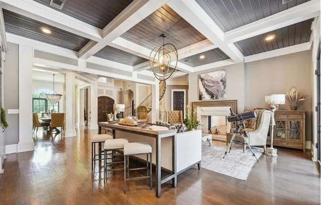 lobby with beam ceiling, coffered ceiling, recessed lighting, and ornamental molding