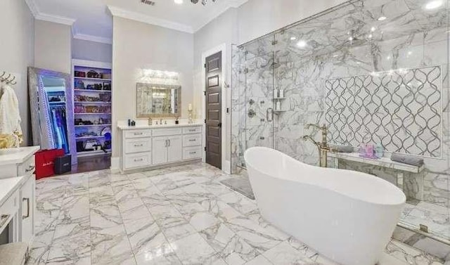 full bath featuring ornamental molding, a soaking tub, marble tiled flooring, vanity, and walk in shower