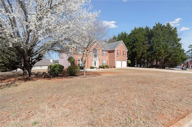 view of front of home with a garage and concrete driveway