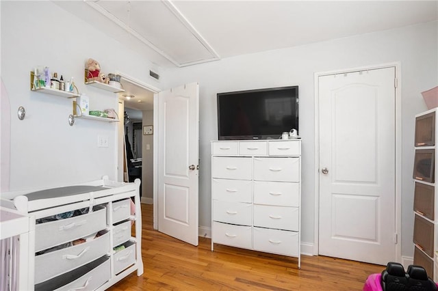 bedroom with light hardwood / wood-style floors