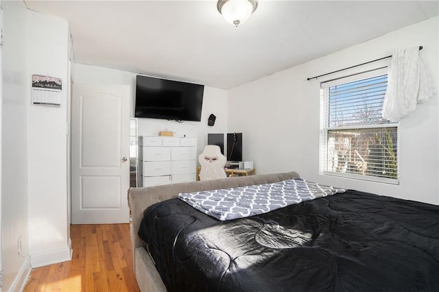 bedroom featuring light wood-type flooring