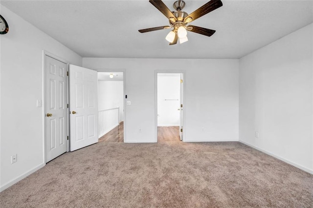 unfurnished bedroom with carpet flooring and ceiling fan