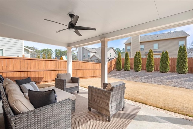 view of patio / terrace with ceiling fan, a fenced backyard, and an outdoor living space