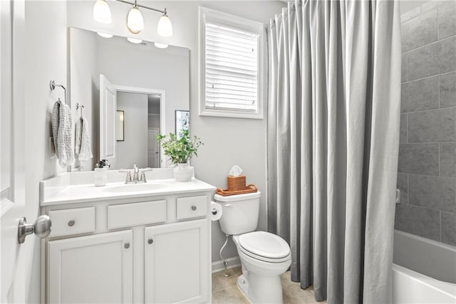 bathroom featuring shower / tub combo, baseboards, toilet, tile patterned flooring, and vanity