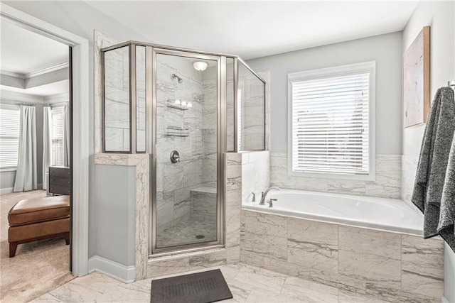 full bath with marble finish floor, a garden tub, ornamental molding, a shower stall, and baseboards