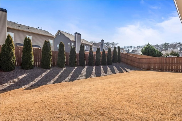 view of yard featuring a fenced backyard