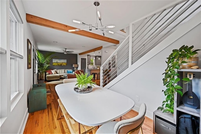 670 Parker Ave, Decatur, GA 30032 - dining space with baseboards, wood finished floors, a chandelier, stairway, and beam ceiling