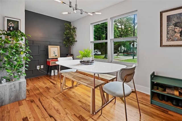 670 Parker Ave, Decatur, GA 30032 - dining room with wood finished floors, a chandelier, and baseboards