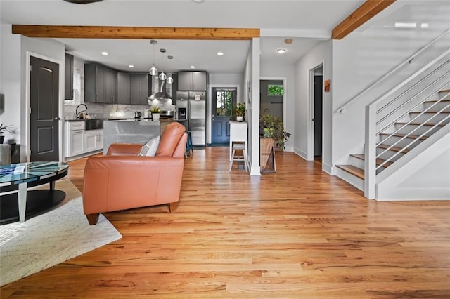 670 Parker Ave, Decatur, GA 30032 - living area with beam ceiling, light wood-type flooring, recessed lighting, stairs, and baseboards