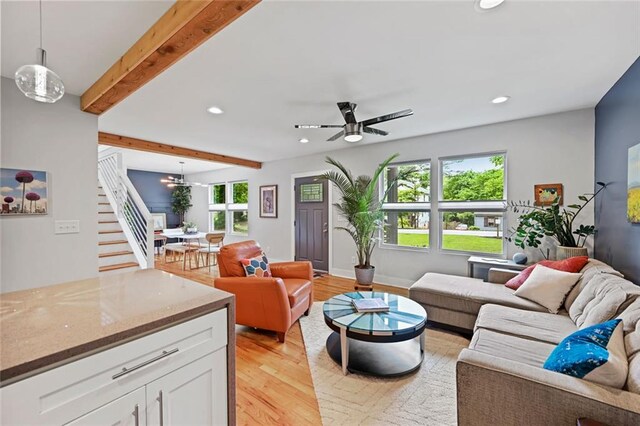 670 Parker Ave, Decatur, GA 30032 - living room featuring stairs, recessed lighting, plenty of natural light, light wood finished floors, and beam ceiling