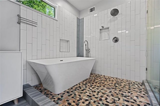 670 Parker Ave, Decatur, GA 30032 - bathroom featuring tiled shower and a soaking tub