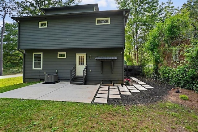 670 Parker Ave, Decatur, GA 30032 - rear view of property with entry steps, a patio, a lawn, and central AC unit