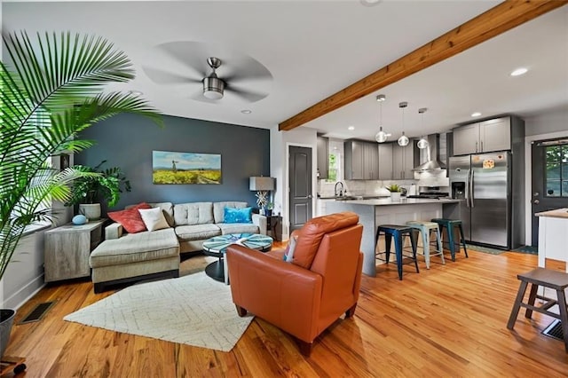 670 Parker Ave, Decatur, GA 30032 - living area with healthy amount of natural light, light wood-style floors, ceiling fan, beam ceiling, and recessed lighting