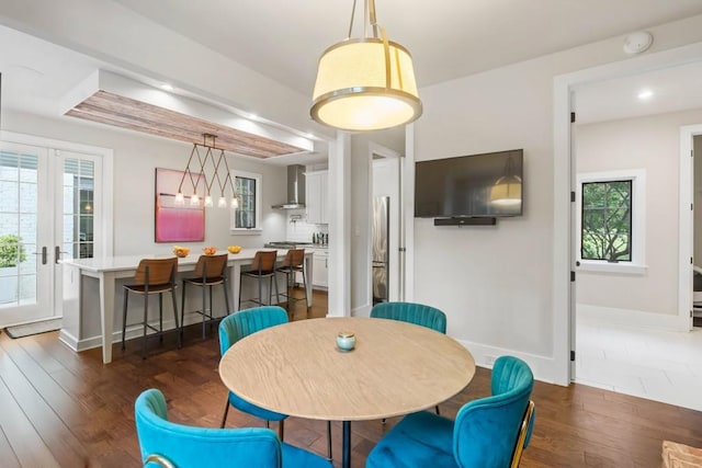 dining room with baseboards, dark wood-style floors, and recessed lighting