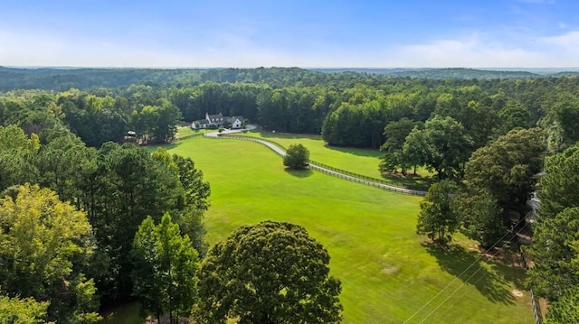 aerial view of sparsely populated area featuring a forest