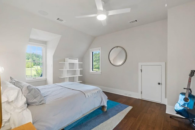 bedroom featuring wood finished floors, lofted ceiling, baseboards, and ceiling fan