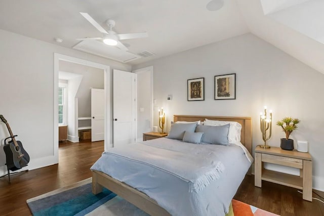 bedroom featuring wood finished floors, lofted ceiling, and a ceiling fan
