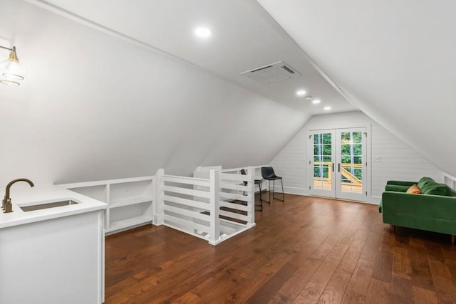 bonus room with a sink, dark wood finished floors, and lofted ceiling