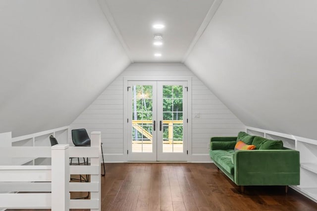 bonus room featuring hardwood / wood-style flooring, lofted ceiling, wood walls, and french doors