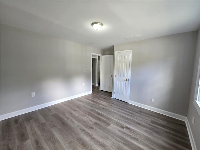 1753 Cahoon St SW, Atlanta, GA 30310 - spare room with dark wood-type flooring and baseboards