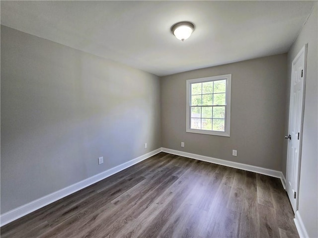 1753 Cahoon St SW, Atlanta, GA 30310 - unfurnished room with dark wood-type flooring and baseboards
