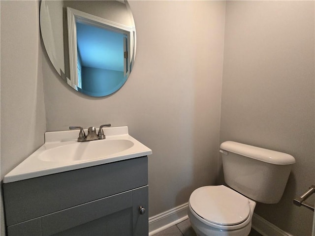 1753 Cahoon St SW, Atlanta, GA 30310 - bathroom featuring vanity, toilet, baseboards, and tile patterned floors