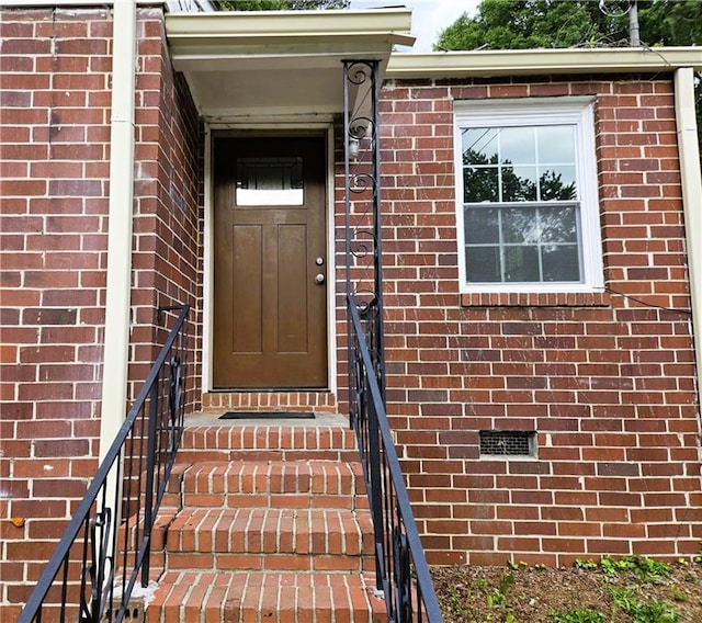 1753 Cahoon St SW, Atlanta, GA 30310 - view of exterior entry featuring brick siding and crawl space