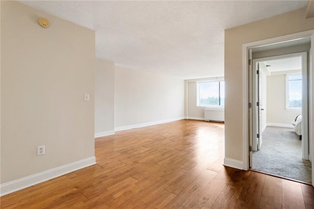 empty room featuring hardwood / wood-style floors