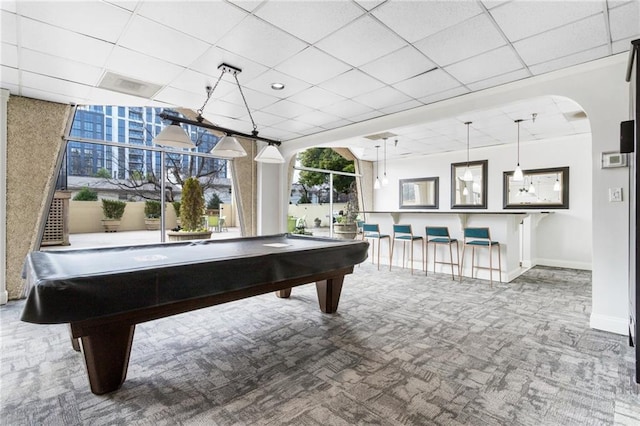 recreation room with billiards, a paneled ceiling, and carpet