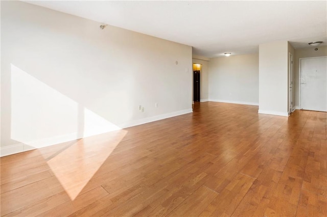 unfurnished room featuring wood-type flooring