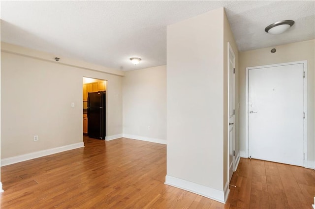 empty room featuring hardwood / wood-style floors