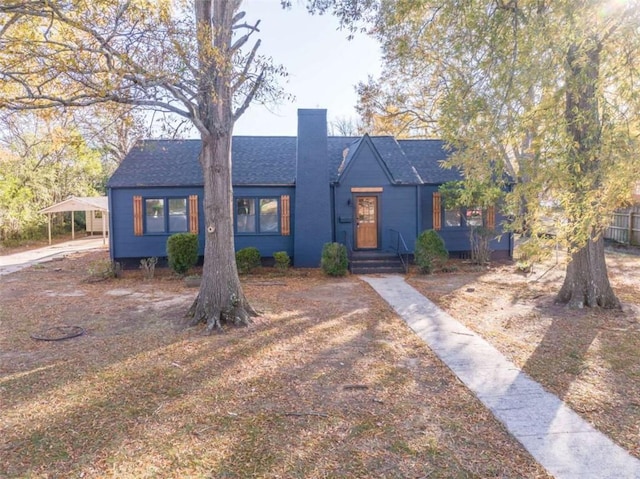 view of front of home with a carport