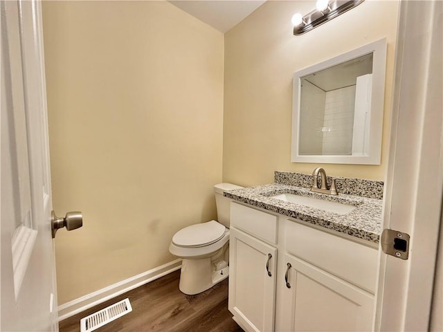 93 Mill Creek Rd, Hiram, GA 30141 - bathroom featuring baseboards, toilet, visible vents, vanity, and wood finished floors