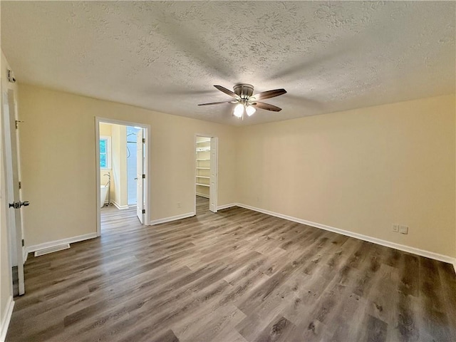 93 Mill Creek Rd, Hiram, GA 30141 - spare room with baseboards, ceiling fan, a textured ceiling, and wood finished floors
