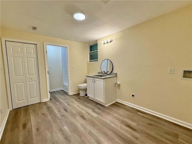93 Mill Creek Rd, Hiram, GA 30141 - bathroom with toilet, wood finished floors, visible vents, baseboards, and vanity