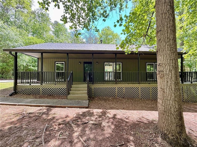 93 Mill Creek Rd, Hiram, GA 30141 - view of front of home with board and batten siding, a porch, and a shingled roof