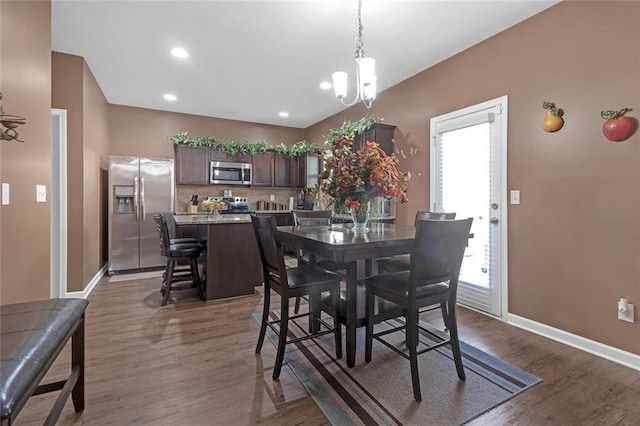 dining room featuring a chandelier, recessed lighting, wood finished floors, and baseboards