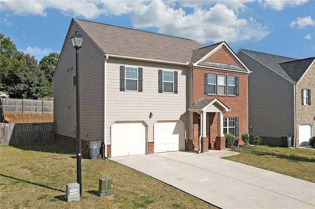 view of front of house with brick siding, concrete driveway, fence, a garage, and a front lawn