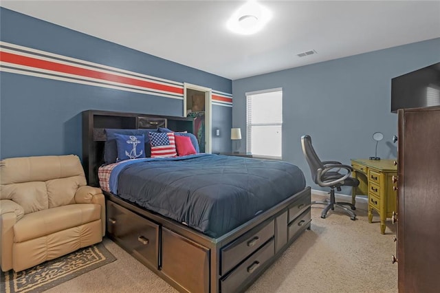 bedroom featuring baseboards, visible vents, and light colored carpet