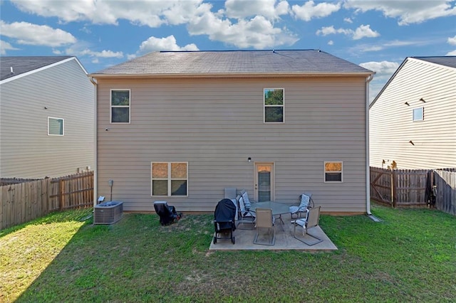 rear view of house featuring central air condition unit, a patio area, a fenced backyard, and a lawn