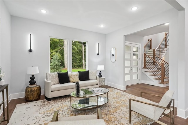 living room with dark hardwood / wood-style flooring